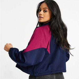 Adidas Originals adicolor block color track top in navy.